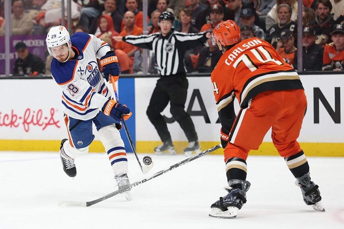 ANAHEIM, CALIFORNIA - APRIL 30: Jack Roslovic #28 of the Edmonton Oilers shoots as John Carlson #74 of the Anaheim Ducks defends during the first period in Game Six of the First Round of the 2026 Stanley Cup Playoffs at Honda Center on April 30, 2026 in Anaheim, California. (Photo by Sean M. Haffey/Getty Images)