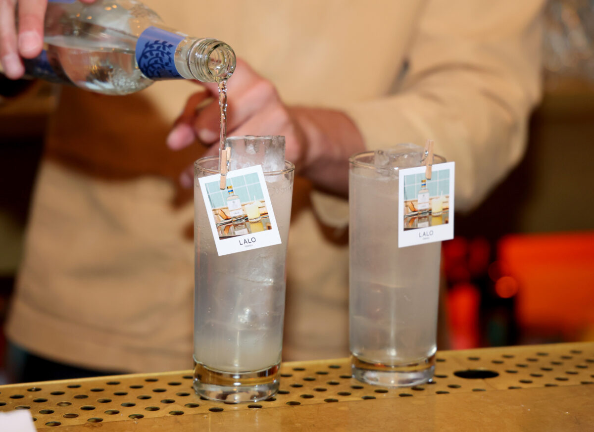 Pouring LALO Tequila at the LALO x Charley Hull event