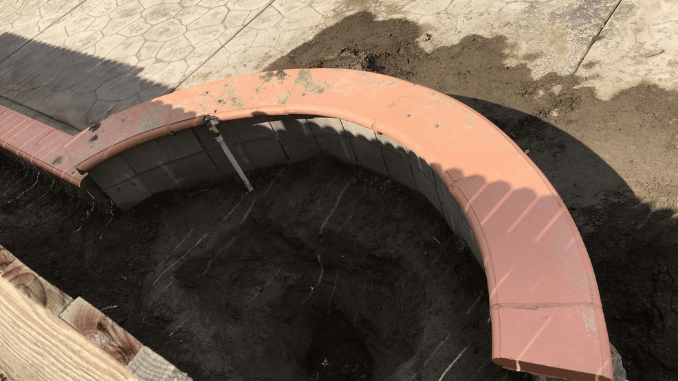 The backyard of a home in southwest Bakersfield, Calif., where police said a newborn baby was murdered and buried, is seen Thursday, Feb. 28, 2019. (KBAK/KBFX photo)