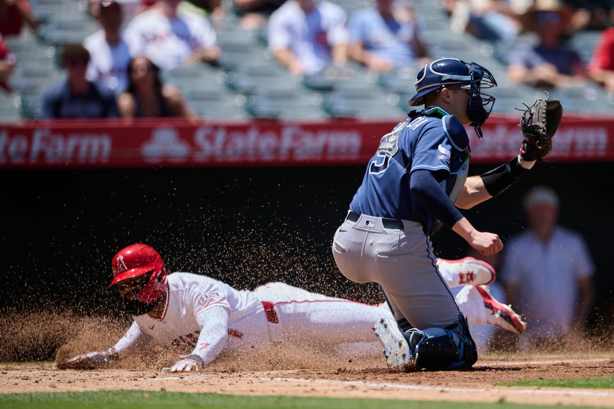 The Los Angeles Angels Jo Adell #7 slides into home base during an MLB game against The Tampa Bay Rays on June 14th, 2026 at Angel Stadium in Anaheim, California. The Los Angeles Angels Jo Adell #7 slides into home base during an MLB game against The Tampa Bay Rays on June 14th, 2026 at Angel Stadium in Anaheim, California.