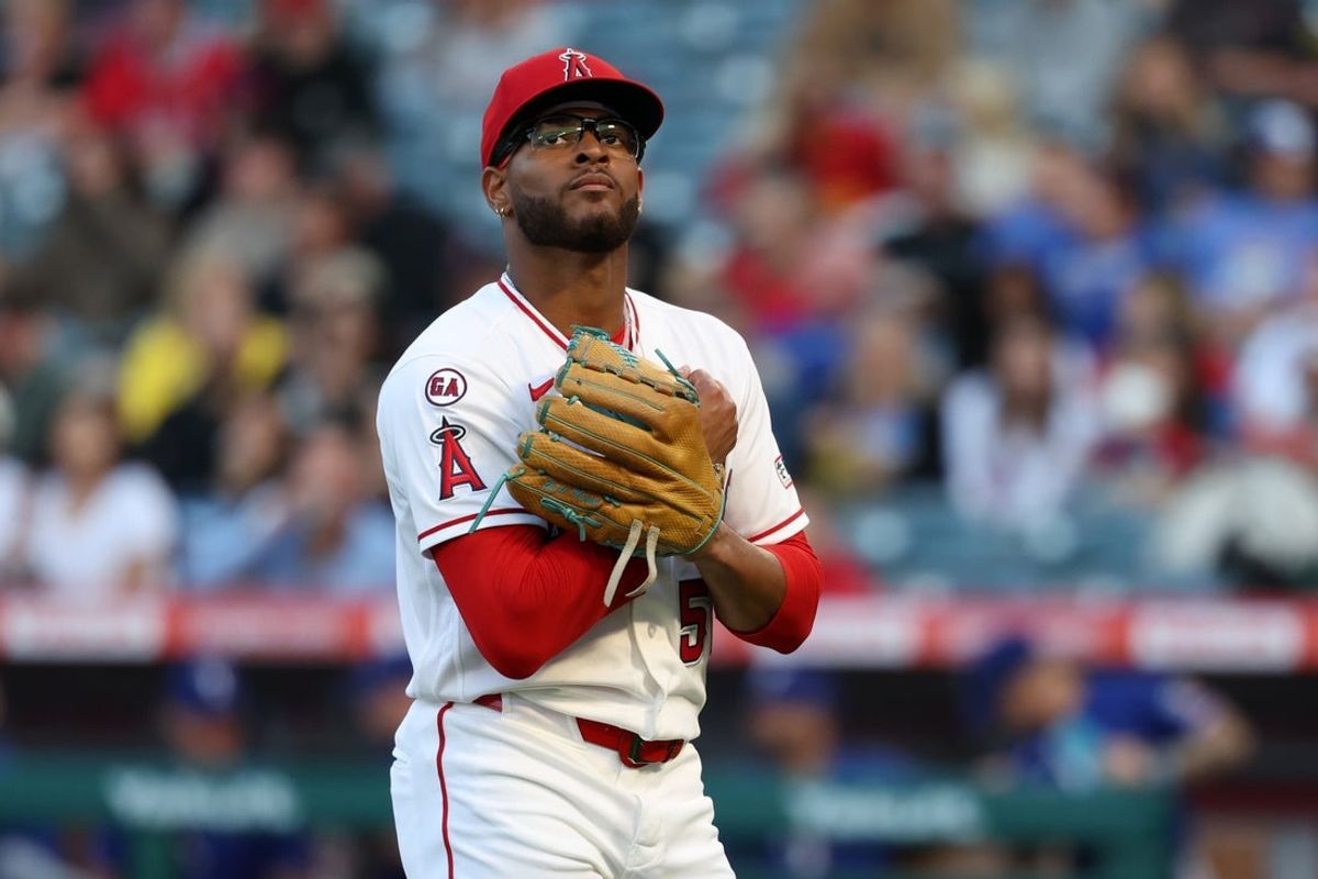 May 23, 2026; Anaheim, California, USA;  Los Angeles Angels pitcher Walbert Urena (57) reacts after getting a third out of the inning in the first inning against the Texas Rangers at Angel Stadium. Mandatory Credit: Kiyoshi Mio-Imagn Images