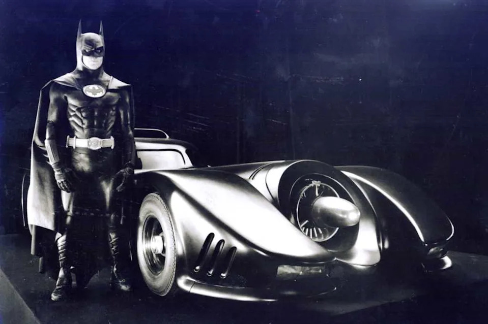 Michael Keaton as Batman with his “Batmobile” for “Batman” the movie. DC Comics Inc