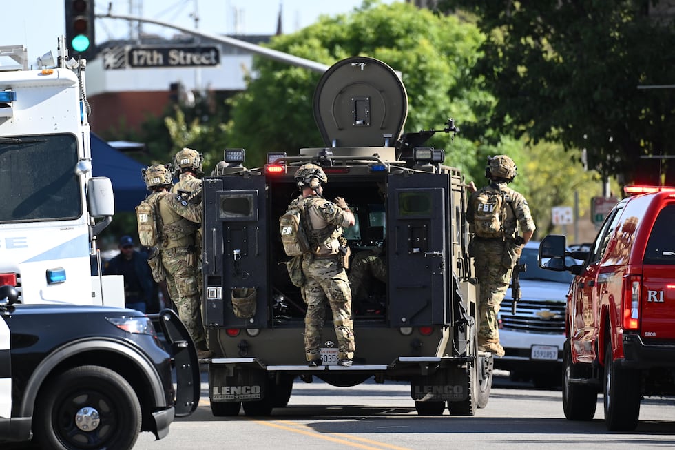 FBI agents near the site where a man took hostages in Bakersfield, California, on June 2,...
