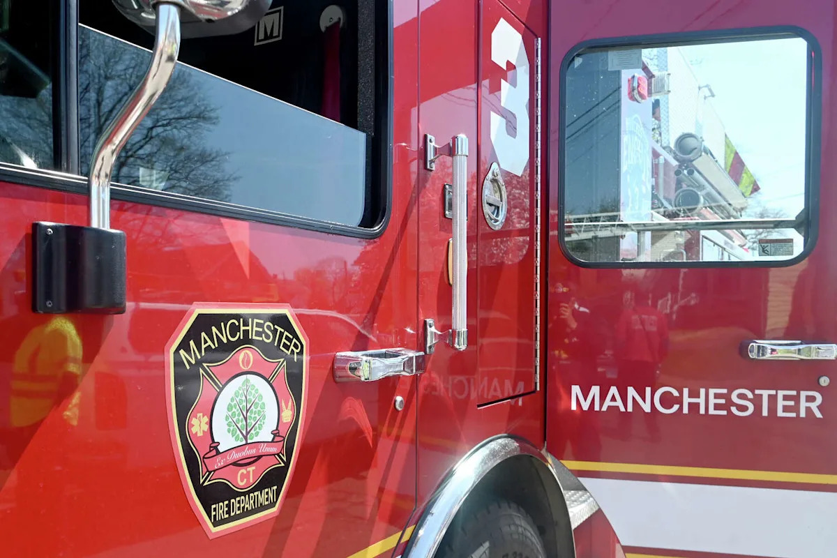 2 occupants freed from Manchester rollover crash at Oakland Street intersection, official says