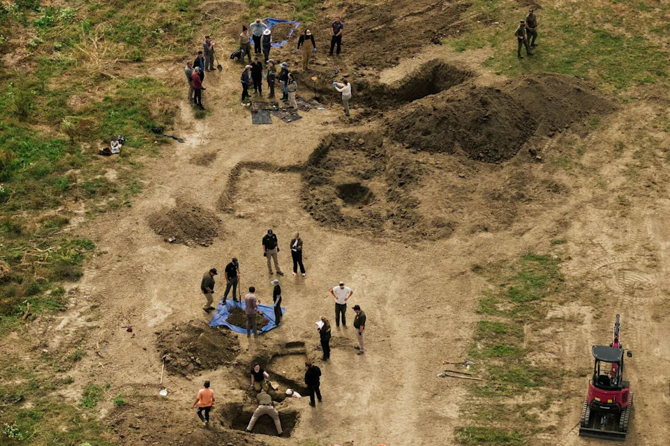 In an aerial view, investigators search for animal remains while executing a second search warrant at Miranda's Rescue as part of an active investigation into alleged animal cruelty, fraud and theft in Fortuna on Tuesday. Humboldt County investigators recovered 117 intact dog remains from Miranda's Rescue during a three-day search warrant operation. Officials said many of the dogs showed evidence of bullet fragments, and more than 600 collars were found in a barn. (Stephen Lam/S.F. Chronicle)