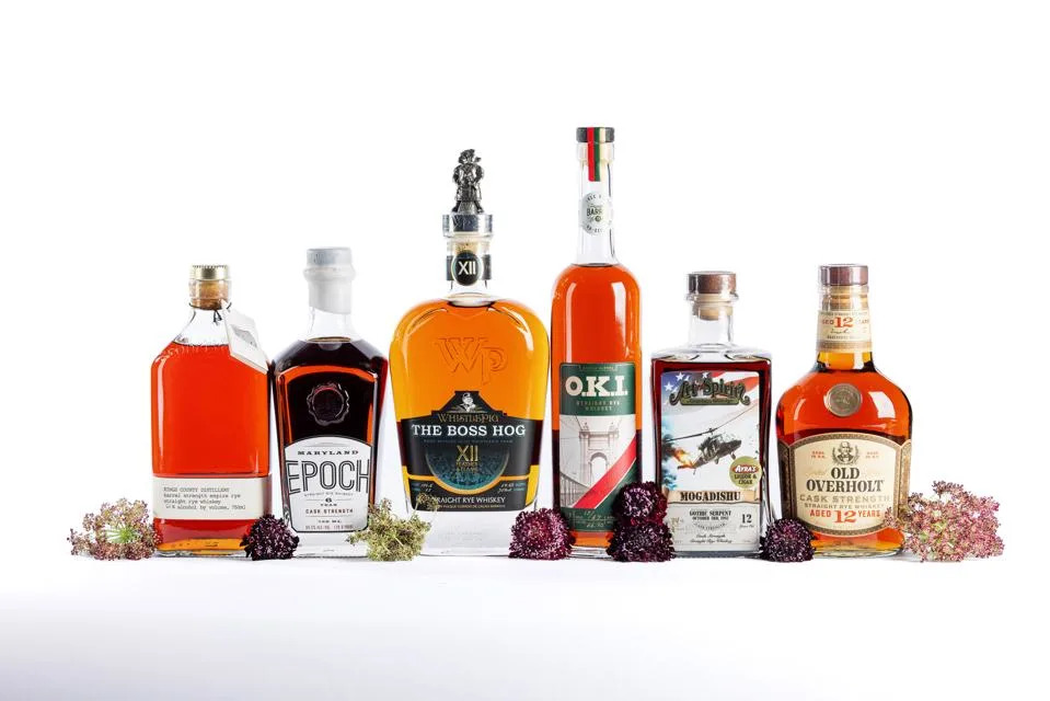 Bottles of rye whiskey lined up in a row.