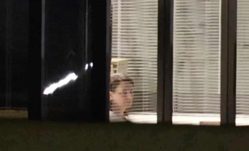 A photo showing one of the alleged hostages from inside the bank. KNN
