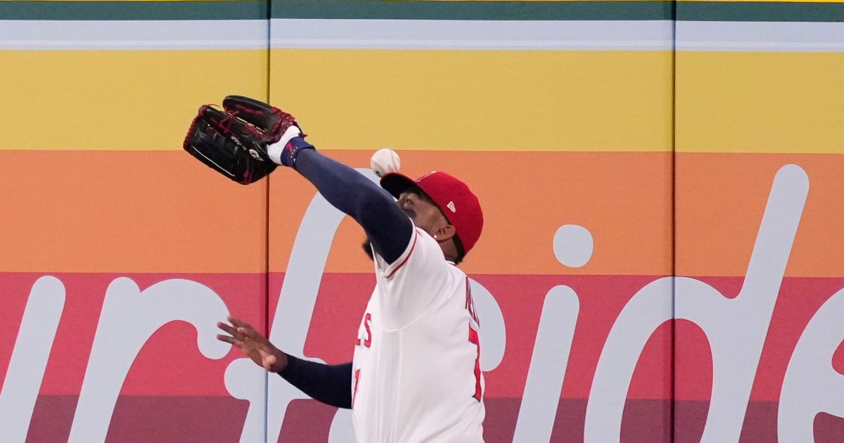 Angels outfielder Jo Adell misplays flyball into home run off his head, much like Canseco in 1993 :: WRAL.com