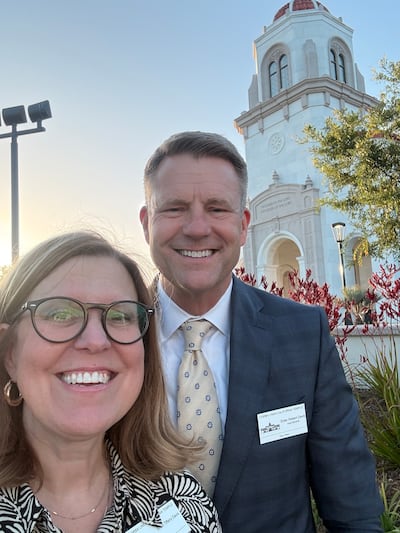 Elder Robert L. Davis, an Area Seventy, and his wife, Tiffany Davis, pose for a photo outside the Yorba Linda Temple during the public open house in Yorba Linda, California in May 2026.