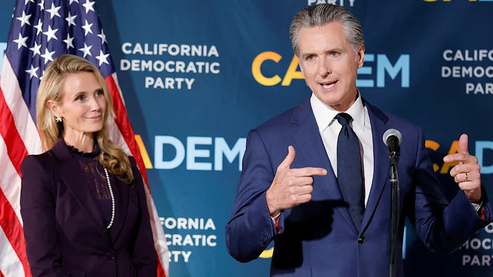 California Gov. Gavin Newsom speaking next to his wife Jennifer Siebel Newsom at California Democratic Party Headquarters in Sacramento