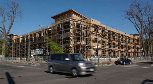 The Fremont Mews, being built in downtown Sacramento is shown Thursday, March 31, 2005. Opponents of the project delayed its construction for months by filing a lawsuit alleging insufficient environmental studies had been performed. The Fremont Mews is one of many examples around the state in which builders claim opponents use the California Environmental Quality Act to block projects for more than just environmental considerations. (AP Photo/Rich Pedroncelli)