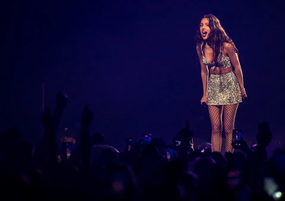Olivia Rodrigo talks with the crowd after finishing "ballad of a homeschooled girl" during the first stop on the "Guts" tour at Acrisure Arena in Palm Desert, Calif., Friday, Feb. 23, 2024.