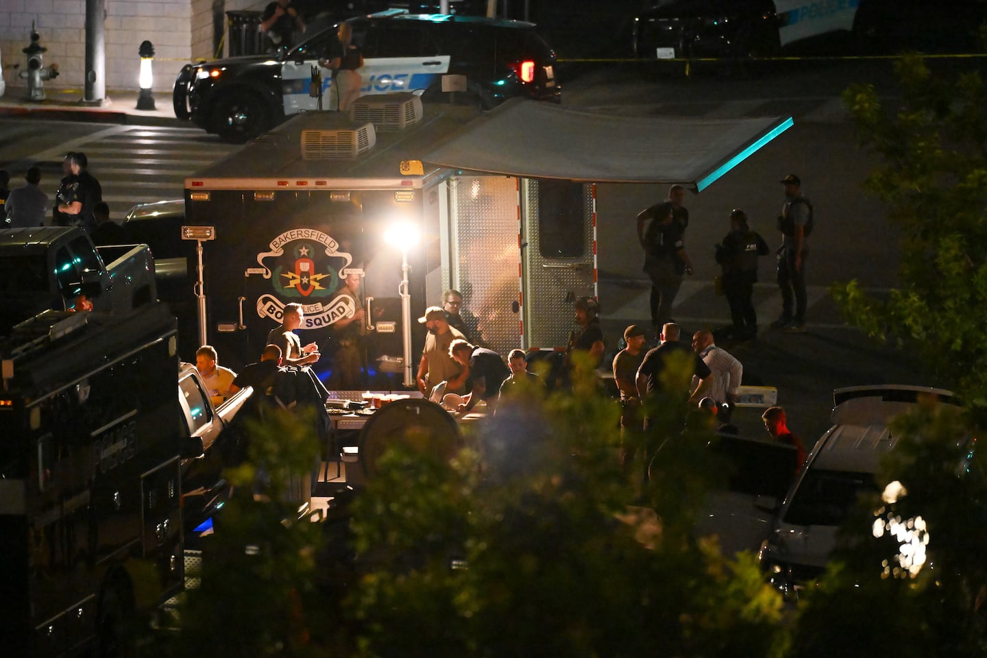 Law enforcement respond after a man barricaded himself inside a building with hostages, June 2, in Bakersfield, Calif.
