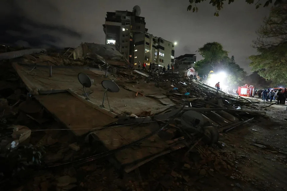Rescue workers in Caracas search a collapsed building for survivors after Wednesday's quakes.