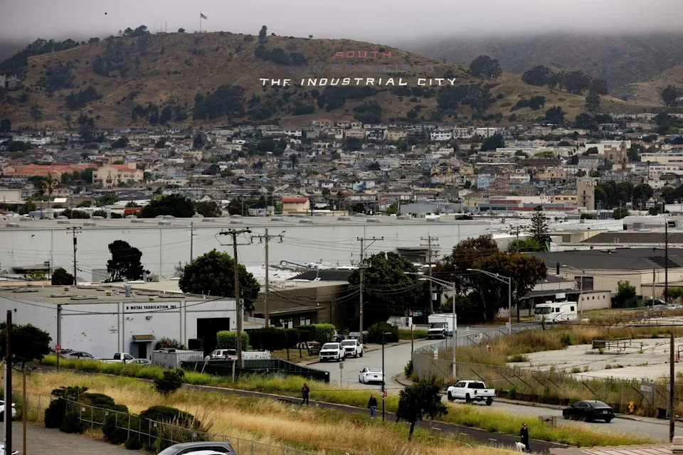 The South San Francisco hillside sign on Monday, June 15, 2026. The sign has been repainted red, white and blue for the nation's semiquincentennial. (Santiago Mejia/S.F. Chronicle)