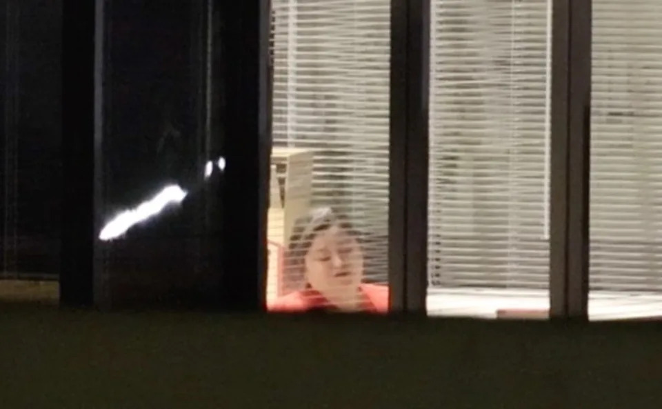 A photo showing one of the alleged hostages from inside the bank. KNN
