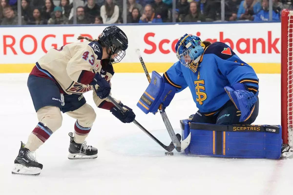 FILE - Toronto Sceptres goaltender Raygan Kirk saves a shot from Montreal Victoire's Kristen O'Neill during the first period of a PWHL hockey game in Toronto, Dec. 21, 2024. (Chris Young/The Canadian Press via AP, File)