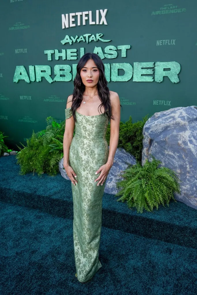 Yvonne Chapman wears a sage-green Sau Lee gown to the Avatar: The Last Airbender Season 2 premiere in Los Angeles.