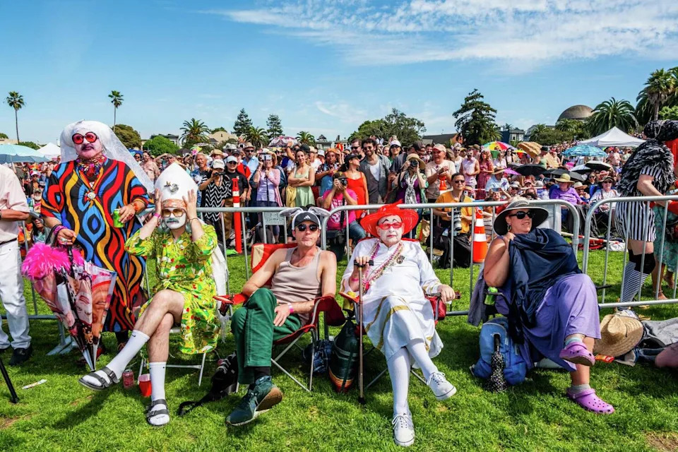 Thousands in costumes or dressed for spring fill Dolores Park to watch the Hunky Jesus contest on Easter Sunday on April 5. (Camille Cohen/For the S.F. Chronicle)