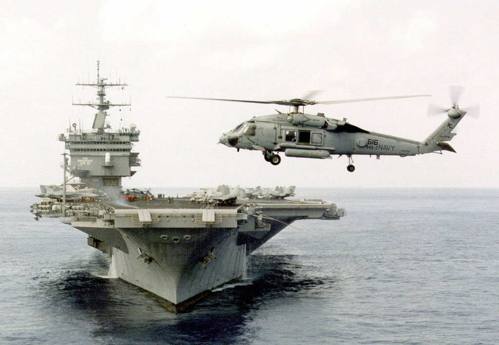 An SH-60 Blackhawk helicopter assigned to Helicopter Anti-Submarine Squadron Seven (HS-7) hovers off the bow of the aircraft carrier USS Enterprise CVN 65. The Enterprise and HS-7 are engaged in Composite Training Unit Exercise (COMPTUEX) in the Puerto Rico operating area. (DoD photo by Petty Officer 3rd Class Timothy Smith. (Released))