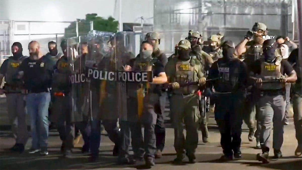 Anti-ICE agitators blocking vehicles outside Delaney Hall detention facility in Newark
