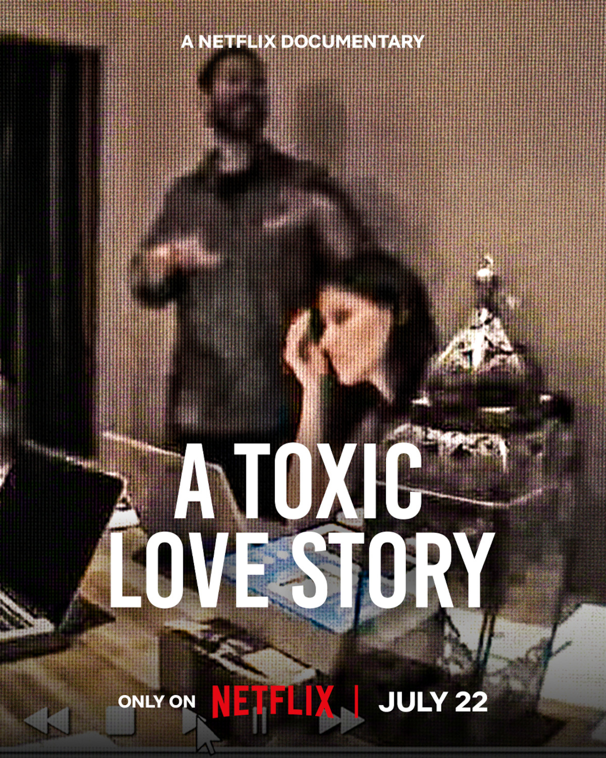 Two people in a dimly lit room, one sitting at a desk with a laptop and holding their head, the other standing behind. Text overlay reads "A Toxic Love Story," promoting a Netflix documentary, streaming July 22.
