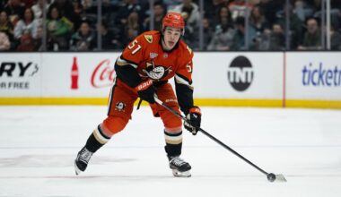Anaheim Ducks defenseman Olen Zellweger (51) controls the puck during an NHL hockey game against the Seattle Kraken, Tuesday, Feb. 3, 2026, in Anaheim, Calif. (AP Photo/Kyusung Gong)