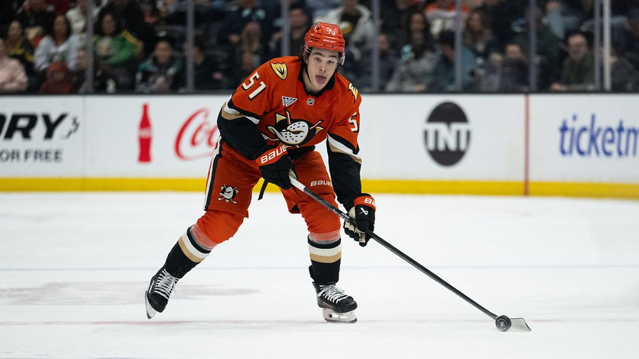 Anaheim Ducks defenseman Olen Zellweger (51) controls the puck during an NHL hockey game against the Seattle Kraken, Tuesday, Feb. 3, 2026, in Anaheim, Calif. (AP Photo/Kyusung Gong)