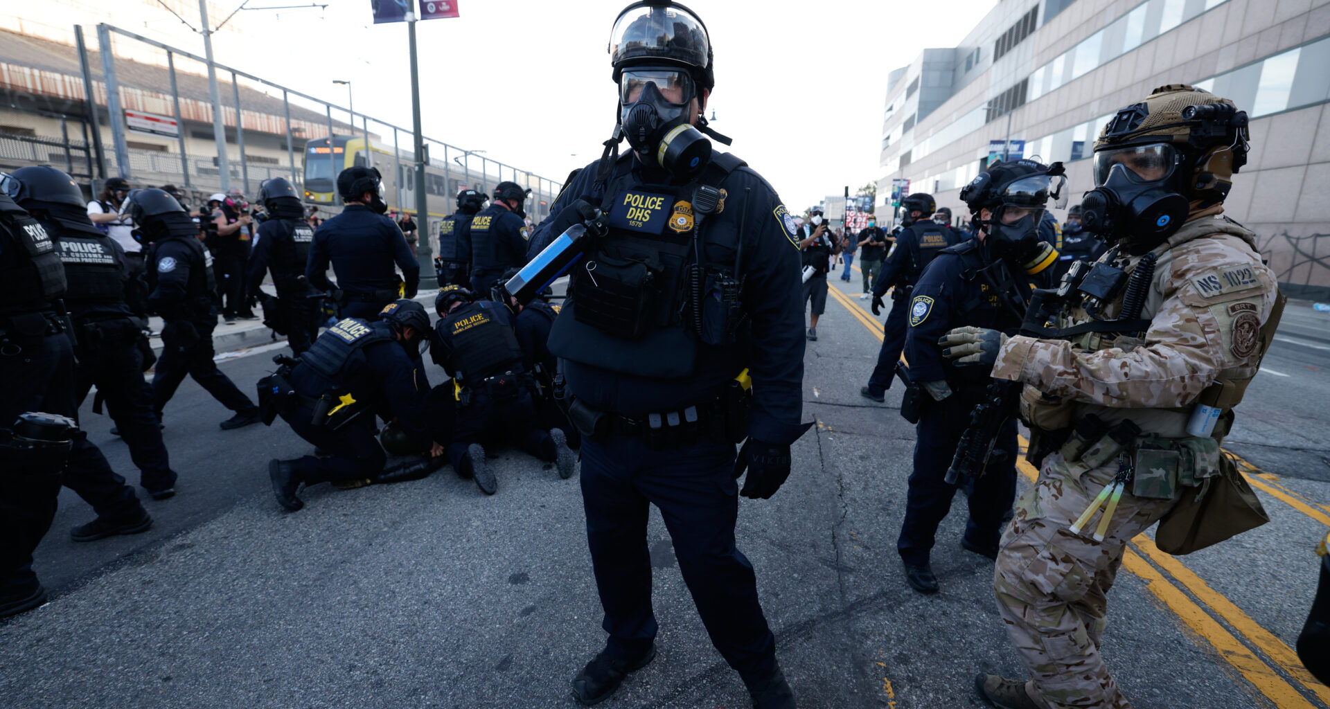 DHS police detain a protestor near the Metropolitan Detention Center in downtown Los Angeles during a "No Kings" protest Saturday, March 28, 2026. (AP Photo/Jill Connelly)
