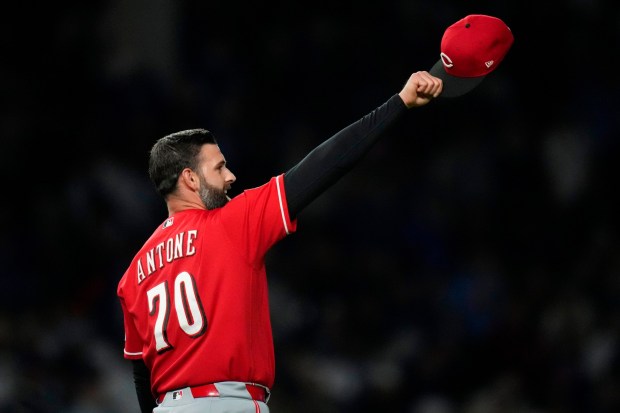 Cincinnati Reds' pitcher Tejay Antone signals to the outfield during the eighth inning of a baseball game against the Chicago Cubs, Wednesday, May 6, 2026, in Chicago. (AP Photo/Erin Hooley)