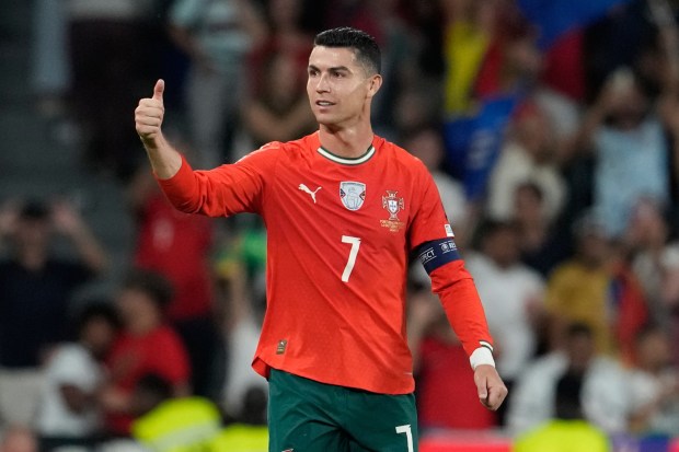 Portugal's Cristiano Ronaldo celebrates after scoring during a World Cup 2026 Group F qualifying soccer match between Portugal and Hungary in Lisbon, Oct. 14, 2025. (AP Photo/Armando Franca, File)