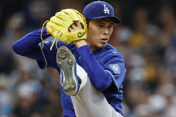 Dodgers starting pitcher Roki Sasaki throws to the plate during the first inning of a game against the Milwaukee Brewers on Saturday night in Milwaukee. (AP Photo/Jeffrey Phelps)