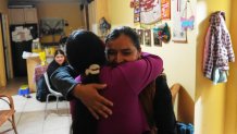 Mirsy Maricela Alva Lopez, right, embraces a relative as she and her children return to the home they all shared in West Palm Beach, Fla., nearly one year after being separated by the U.S. government for the second time, Thursday, May 28, 2026.