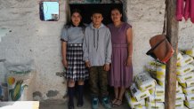 Mirsy Maricela Alva López, right, and her children, Ederson, center, and Briseidy pose for photos at their house in San Martín Cuchumatán, Guatemala, Thursday, April 30, 2026.