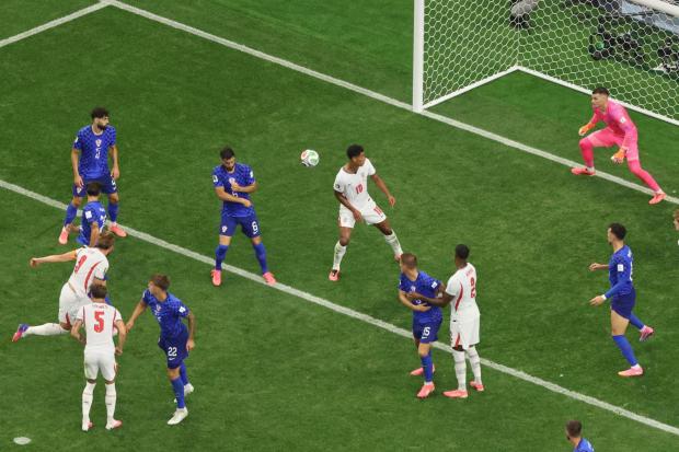 England's Harry Kane scores during the World Cup match between England and Croatia.