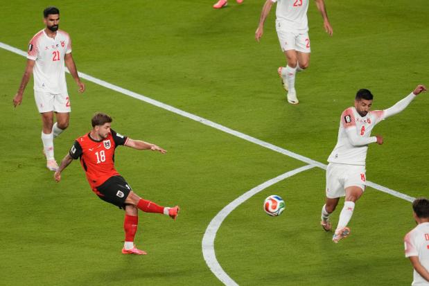 Austria's Romano Schmid scores his side's opening goal against Jordan.