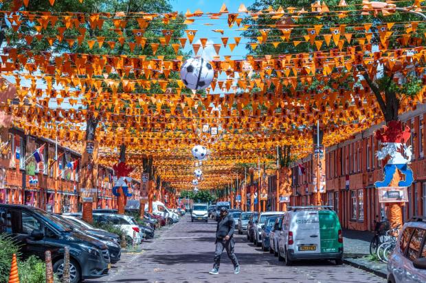 Marktweg Street in The Hague, Netherlands, is decorated ahead of the start of the soccer World Cup, Tuesday, June 9, 2026. (AP Photo/Patrick Post)