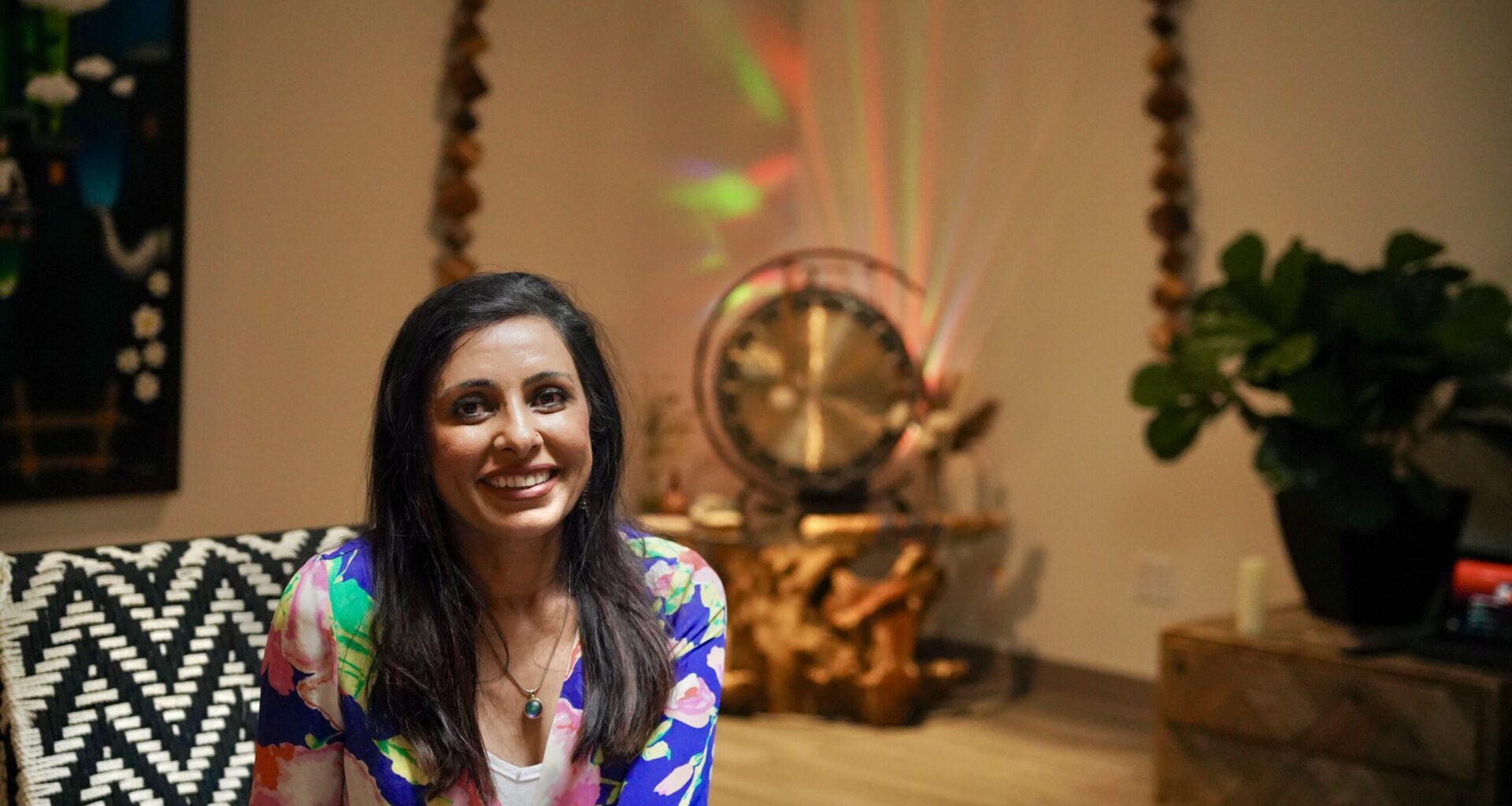 Seated woman poses for the camera.