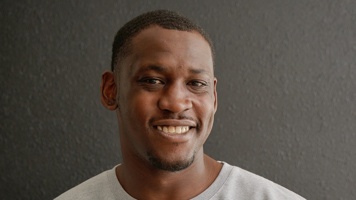 Former NFL star Aldon Smith smiling