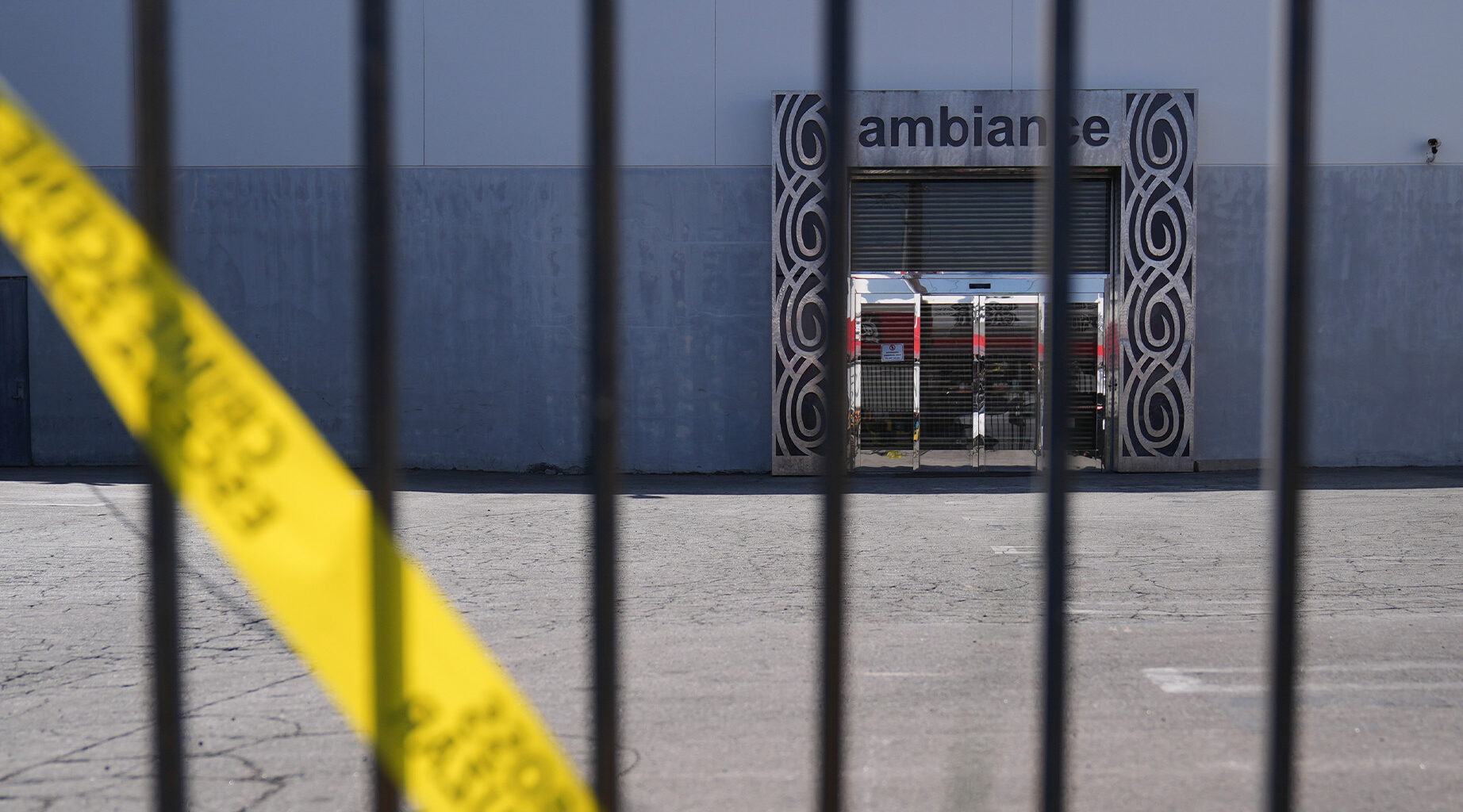 Caution tape hangs outside Ambiance Apparel after federal immigration authorities conducted an operation on Friday, June 6, 2025, in Los Angeles. (AP Photo/Jae C. Hong)