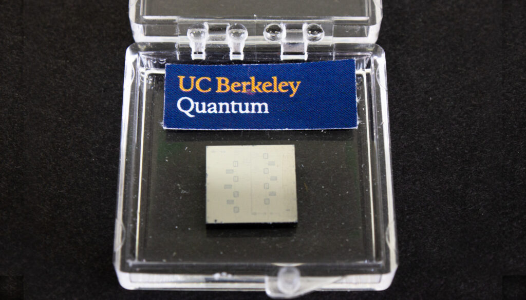 a clear plastic box labeled UC Berkeley Quantum and housing yellowish square