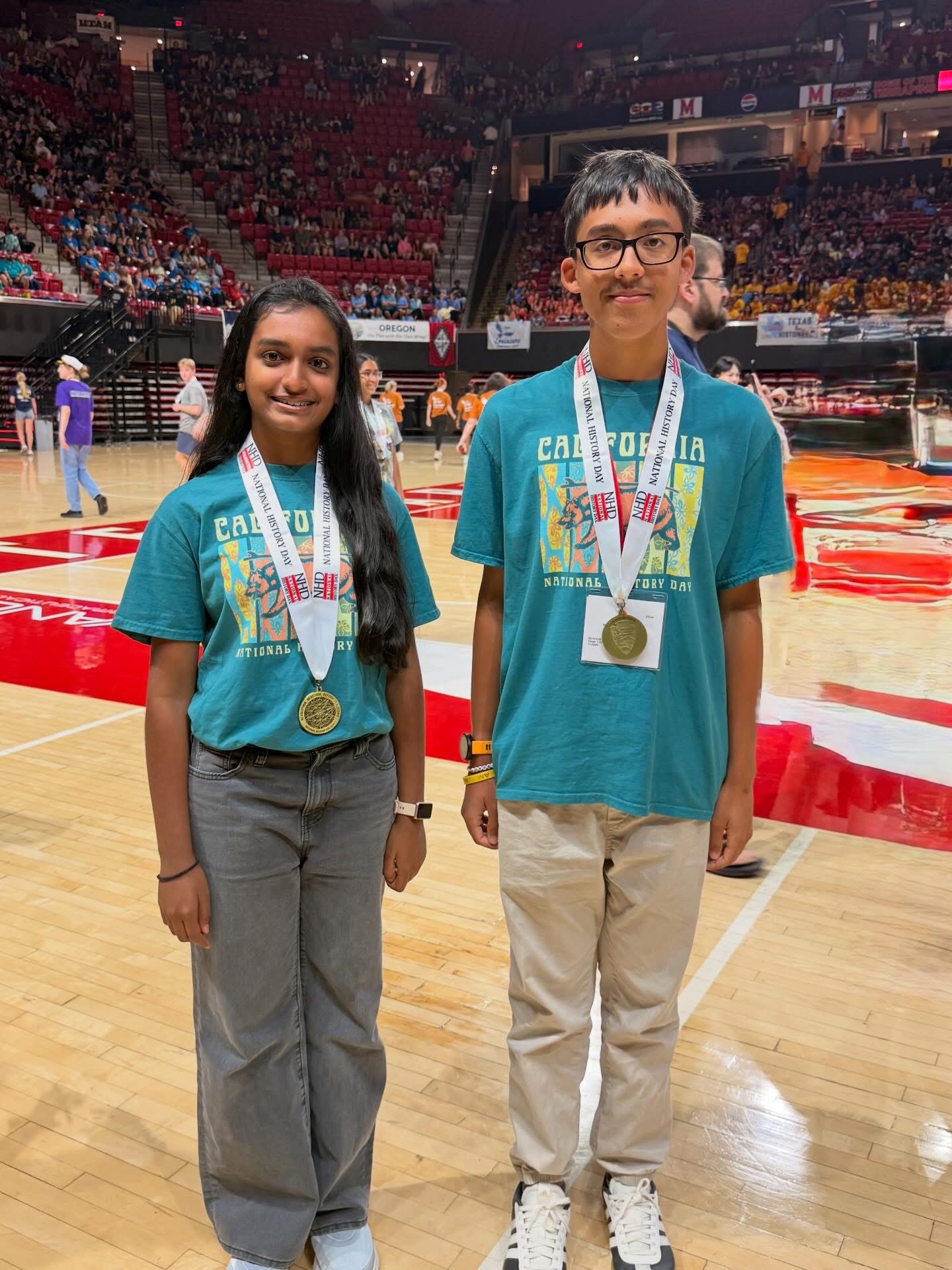 Sierra Vista Middle School student Aria Yatavelli, left, and Irvine High School student Nicholas Soo pose with awards earned at the 2026 National History Day National Contest at the University of Maryland.
