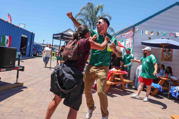Mexican fans celebrate Mexico's first goal against South Africa at the Aloha Club in the Fruitvale district of Oakland, Calif., on Thursday, June 11, 2026, during a live broadcast of the World Cup inaugural match in Mexico City. (Ray Chavez/Bay Area News Group)