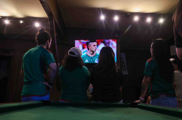 Soccer fans watch a live broadcast of the World Cup inaugural match between Mexico and South Africa at the Aloha Club in the Fruitvale district of Oakland, Thursday, June 11, 2026. (Ray Chavez/Bay Area News Group)