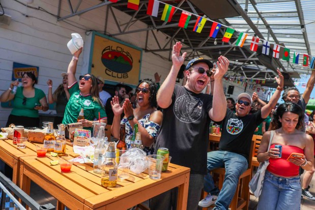 Oakland born and raised, Liam Pierce, center, along with soccer fans celebrate Mexico's second goal against South Africa at the Aloha Club in the Fruitvale district of Oakland, Calif., on Thursday, June 11, 2026, during a live broadcast of the World Cup inaugural match in Mexico City. Pierce who follows Mexican soccer league, said he roots for Mexico whenever they play against the United States. (Ray Chavez/Bay Area News Group