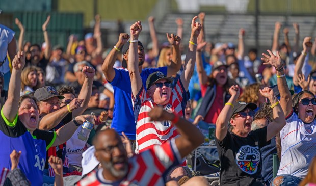 Soccer fans raise their arms in celebration after the United States scored a goal while watching a US World Cup watch party held at Raimondi Park in Oakland, Calif., on Friday, June 12, 2026. The US played their opening match against Paraguay in the World Cup Group D in Inglewood. (Jose Carlos Fajardo/Bay Area News Group)