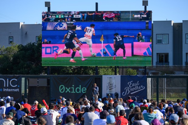 Soccer fans watch a television screen during a US World Cup watch party held at Raimondi Park in Oakland, Calif., on Friday, June 12, 2026. The US played their opening match against Paraguay in the World Cup Group D in Inglewood. (Jose Carlos Fajardo/Bay Area News Group)