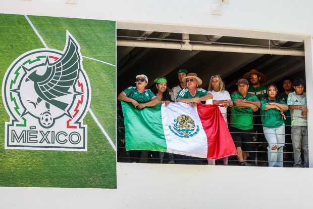 Fans of Mexico watch the World Cup from the parking structure at San Pedro Square Market in San Jose, Calif., on Thursday, June 11, 2026. (Shae Hammond/Bay Area News Group)