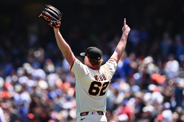 San Francisco Giants pitcher Logan Webb (62) gestures to right field after teammate San Francisco Giants' Jung Hoo Lee (51) makes a catch in the eighth innning of their MLB game at Oracle Park in San Francisco, Calif., on Sunday, June 14, 2026. The San Francisco Giants defeated the Chicago Cubs 5-1. (Jose Carlos Fajardo/Bay Area News Group)
