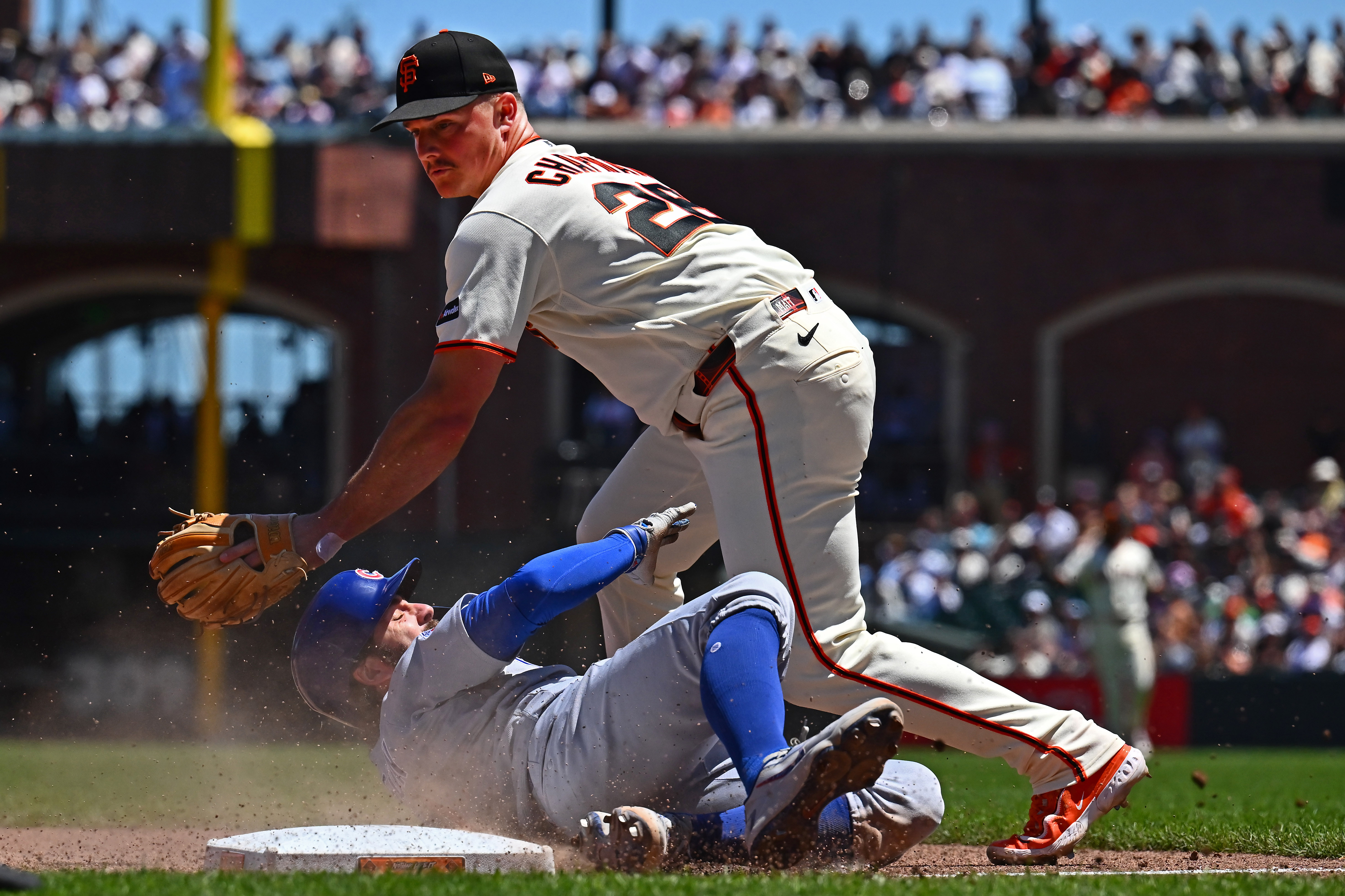 Chicago Cubs' Dansby Swanson (7) is safe at third base...